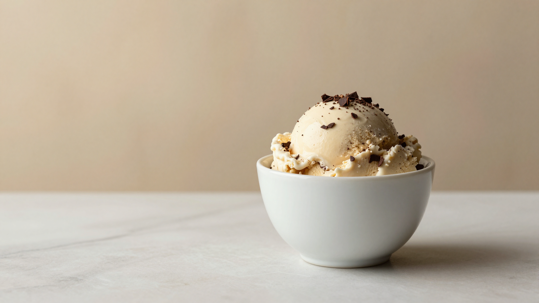 A serving of chocolate chip gelato flecked with fine dark chocolate shards