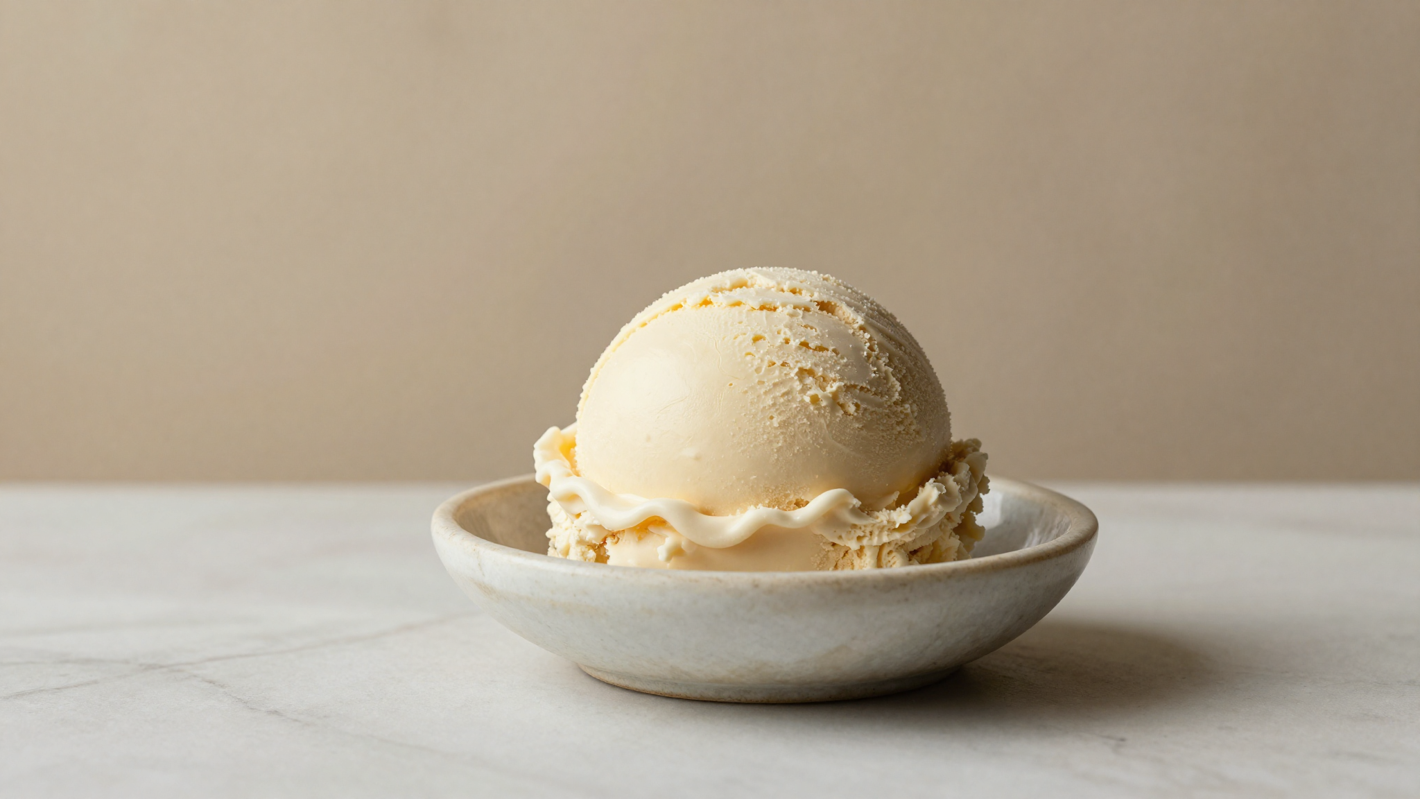 Single dense scoop of artisan gelato showing tight low-air texture