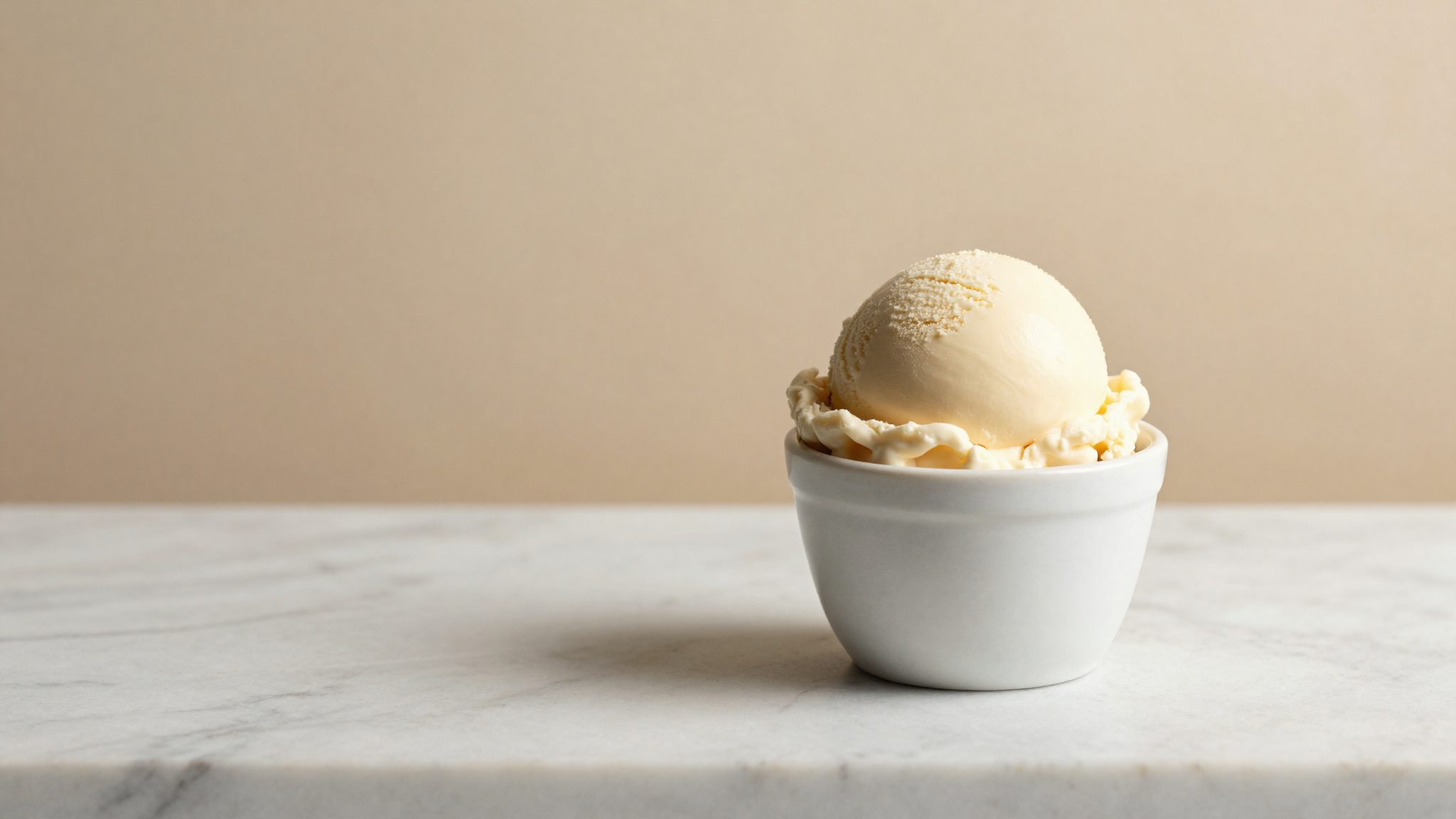 Smooth scoop of gelato in a ceramic cup signaling stable cold chain