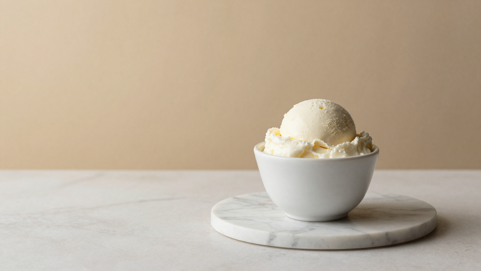 A scoop of probiotic kefir gelato in a small ceramic cup