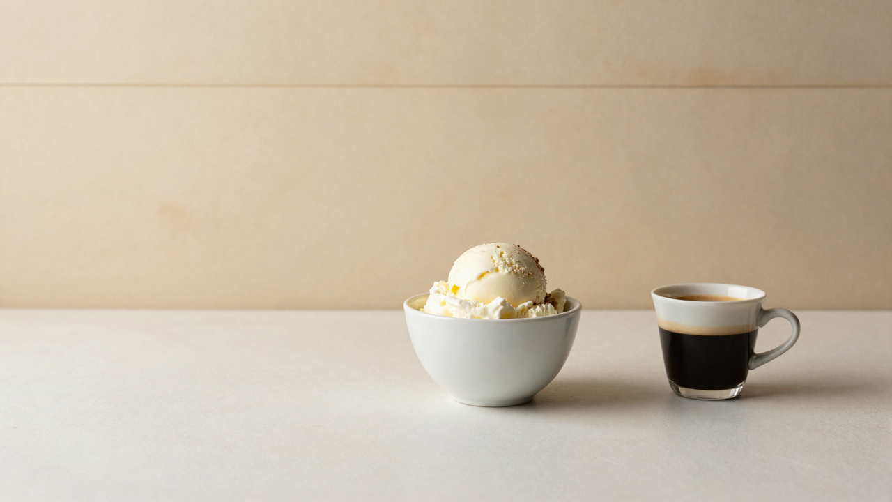 Scoop of mascarpone gelato beside a small espresso cup, tiramisu mood